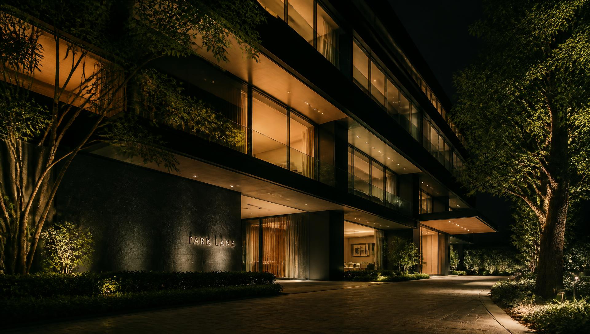 Modern building facade at night with warm interior light